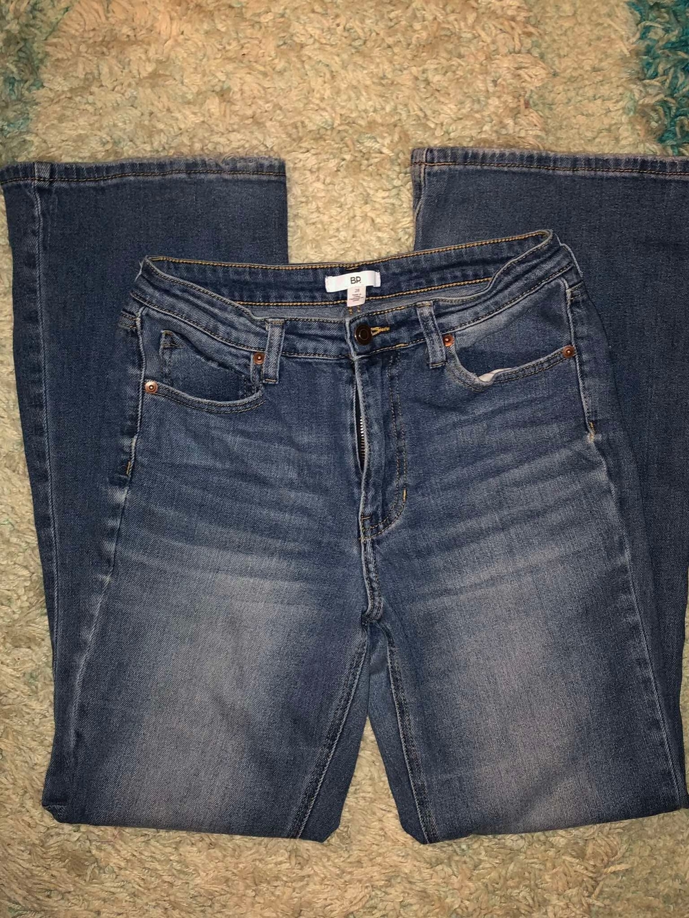 BP. brand high-rise flared jeans with a medium wash